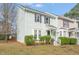 Charming two-story townhouse with light green siding and dark shutters at 621 Bashford Rd, Raleigh, NC 27606
