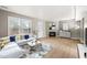 Bright living room featuring a fireplace, stylish furnishings, light gray colored walls and wood-look floors at 621 Bashford Rd, Raleigh, NC 27606