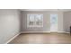 Living room with a bright window and an inviting door, offering a refreshing space at 621 Bashford Rd, Raleigh, NC 27606
