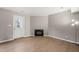 Living room with a cozy fireplace and an inviting door, enhancing the home's appeal at 621 Bashford Rd, Raleigh, NC 27606
