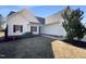 Charming single-story home with white siding and a well-manicured front yard at 70 Waterford Dr, Angier, NC 27501