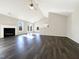 Spacious living room with dark wood floors, fireplace, and natural light at 70 Waterford Dr, Angier, NC 27501