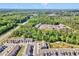 Aerial view of a new neighborhood surrounded by green space and trees at 729 Colby Pl, Durham, NC 27713