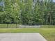 Lush backyard with a fence and ample greenery at 729 Colby Pl, Durham, NC 27713