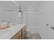 Bathroom with dual sink vanity, quartz counters, tile floor, and tub and shower combo at 729 Colby Pl, Durham, NC 27713