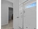 Bathroom features a glass shower, an open doorway to a walk-in closet, and tiled flooring at 729 Colby Pl, Durham, NC 27713
