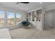 Bedroom features a comfy chair, a built in bookshelf and many windows overlooking the backyard at 729 Colby Pl, Durham, NC 27713