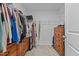 Walk-in closet with wooden shelving provides ample storage for any wardrobe at 729 Colby Pl, Durham, NC 27713