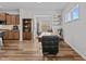 Bright dining room with a wooden table, black chairs, and large windows bringing in natural light at 729 Colby Pl, Durham, NC 27713