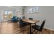 Open dining room featuring a wooden table, modern chairs, and bright windows with natural light at 729 Colby Pl, Durham, NC 27713