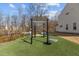 Outdoor exercise area with pull-up bars and other equipment on artificial turf at 729 Colby Pl, Durham, NC 27713