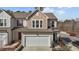 Charming two-story home with gray siding, brown accents, two-car garage, and well maintained front yard at 729 Colby Pl, Durham, NC 27713