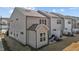 Rear exterior of the home with a private patio and well-maintained lawn at 729 Colby Pl, Durham, NC 27713