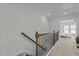 Light-filled hallway with carpet floors leads to a bedroom with bright, natural light and neutral color palette at 729 Colby Pl, Durham, NC 27713