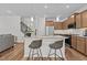 Modern kitchen with granite countertops, stainless steel appliances, and a cozy breakfast bar at 729 Colby Pl, Durham, NC 27713