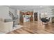 Open floorplan with hardwood floors, neutral decor, island kitchen and dining area at 729 Colby Pl, Durham, NC 27713