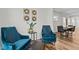 Stylish living room featuring comfortable seating, a side table, and views into the dining area at 729 Colby Pl, Durham, NC 27713