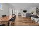 Spacious living room with dining area, kitchen, and ample natural light for a warm and inviting ambiance at 729 Colby Pl, Durham, NC 27713