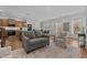 Open concept living area with kitchen, dining, hardwood floors, and neutral colors at 729 Colby Pl, Durham, NC 27713