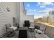 Cozy outdoor patio area complete with comfortable seating, a fire pit, and a privacy fence at 729 Colby Pl, Durham, NC 27713