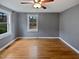 Bedroom featuring hardwood floors, natural light, ceiling fan, and neutral wall paint at 802 Powell Dr, Garner, NC 27529