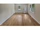 Bright living room featuring hardwood floors, and large windows with outdoor views at 802 Powell Dr, Garner, NC 27529