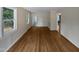 Bright and airy living room with hardwood floors and natural light from the windows at 802 Powell Dr, Garner, NC 27529