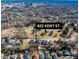 A high angle shows the home nestled among trees and near a bustling city center at 822 Kent St, Durham, NC 27701