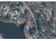 Aerial view showcasing the property with mature trees, including a pool and lake access at , Raleigh, NC 27613