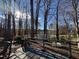 Relaxing backyard deck providing serene views of the calm lake waters through the trees at , Raleigh, NC 27613