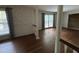 Dining room featuring hardwood floors, columns, decorative wallpaper, and natural light at , Raleigh, NC 27613