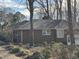 Brick home featuring traditional architecture and lush landscaping in a peaceful setting at , Raleigh, NC 27613