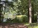 Scenic view of the lake framed by mature trees and lush foliage, offering a tranquil and natural setting at , Raleigh, NC 27613