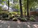 Beautifully landscaped yard with a mix of shrubs, flowers, and mature trees, creating a serene outdoor space at , Raleigh, NC 27613