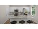 Well-designed kitchen with stainless steel appliances, granite countertops, and a functional island with seating at 916 Canis Minor Rd, Wendell, NC 27591