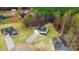 Aerial view of houses surrounded by dense trees showcasing lush landscapes and community layout at 9230 Bear Run Ln, Middlesex, NC 27557