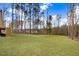 Expansive backyard featuring lush green grass and a backdrop of mature trees, perfect for outdoor activities at 9230 Bear Run Ln, Middlesex, NC 27557