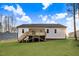 Backyard with a wooden deck, great for entertaining at 9230 Bear Run Ln, Middlesex, NC 27557