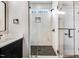 Sleek bathroom featuring a glass-enclosed shower with stone flooring at 9230 Bear Run Ln, Middlesex, NC 27557