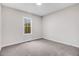 Bedroom with plush carpet and a window with natural light at 9230 Bear Run Ln, Middlesex, NC 27557
