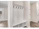 Convenient mudroom with built-in bench, coat hooks, and storage cubbies near the entry at 9230 Bear Run Ln, Middlesex, NC 27557