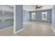 Comfortable bedroom with ample closet space, ceiling fan, and soothing blue walls at 98 S Denise Ave, Coats, NC 27521