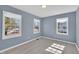 Comfortable bedroom features three windows offering lots of natural sunlight at 98 S Denise Ave, Coats, NC 27521