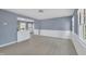 Inviting living room featuring new floors, blue walls and natural light at 98 S Denise Ave, Coats, NC 27521