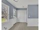 Functional mudroom with a large window, access to the back and storage space at 98 S Denise Ave, Coats, NC 27521