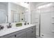 Bright bathroom includes a double sink vanity, a large mirror, and a glass-enclosed shower at 00 Cedar Grove Church Rd Rd, Roxboro, NC 27574