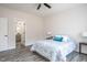 Bedroom featuring a patterned duvet, bedside tables, and an ensuite bathroom at 00 Cedar Grove Church Rd Rd, Roxboro, NC 27574