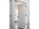 A hallway with white trim and an open door looking into a house with wood floors at 00 Cedar Grove Church Rd Rd, Roxboro, NC 27574