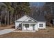 Charming single-story home with white siding, covered front porch, and newly installed driveway at 00 Cedar Grove Church Rd Rd, Roxboro, NC 27574