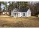 Charming one-story home with white siding, black roof, and covered entryway at 00 Cedar Grove Church Rd Rd, Roxboro, NC 27574